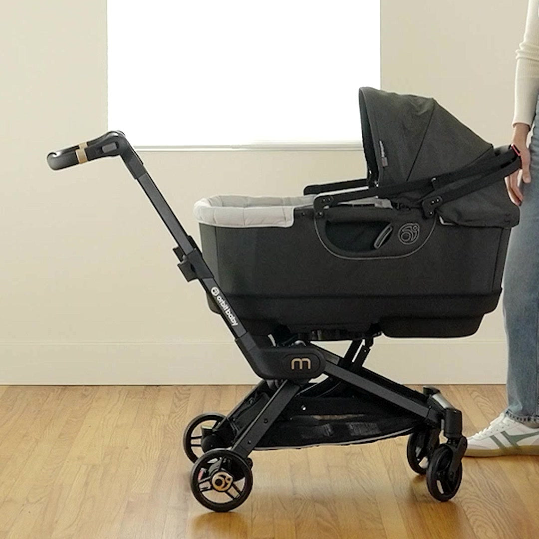 Orbit Baby Travel Bassinet docked on the M+ Stroller SmartHub